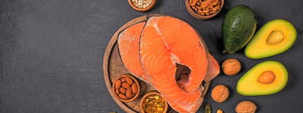 Foods rich in omega fatty acids, including salmon, avocados, and nuts, for better health. 