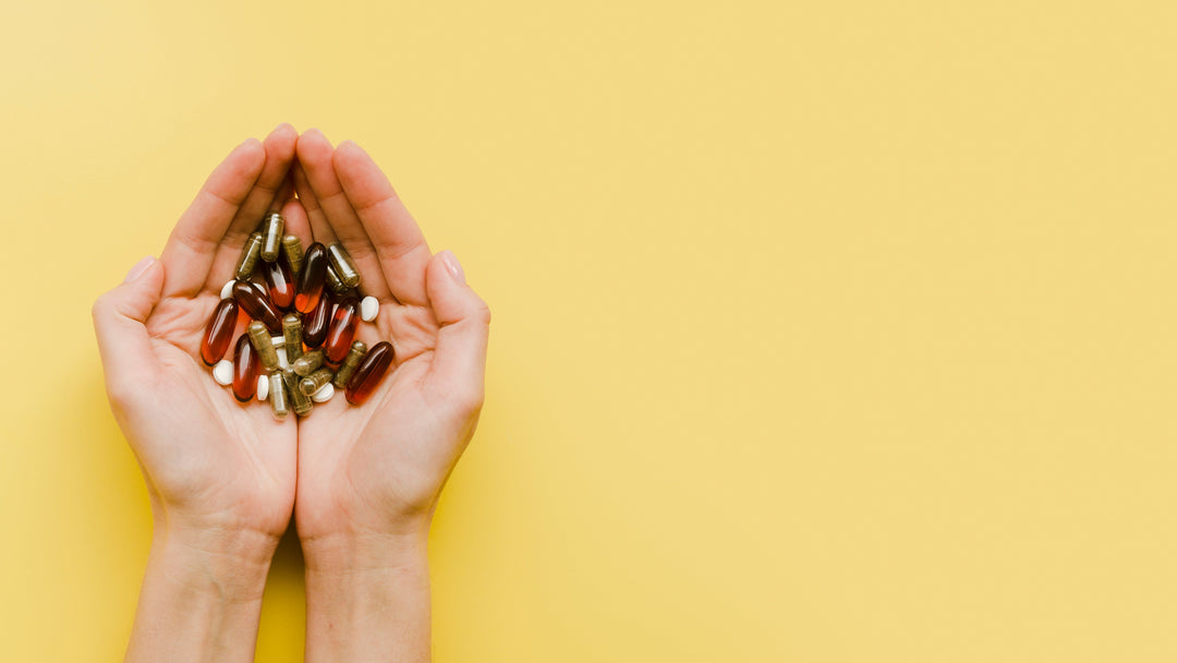 closed hands holding health supplements